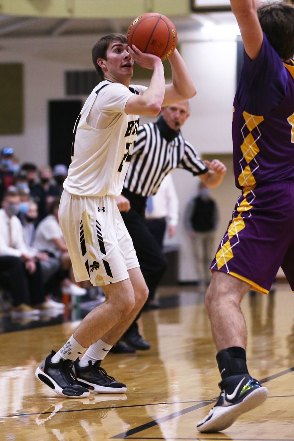 Colby Bessler drops for a 3-point shot during the second quarter